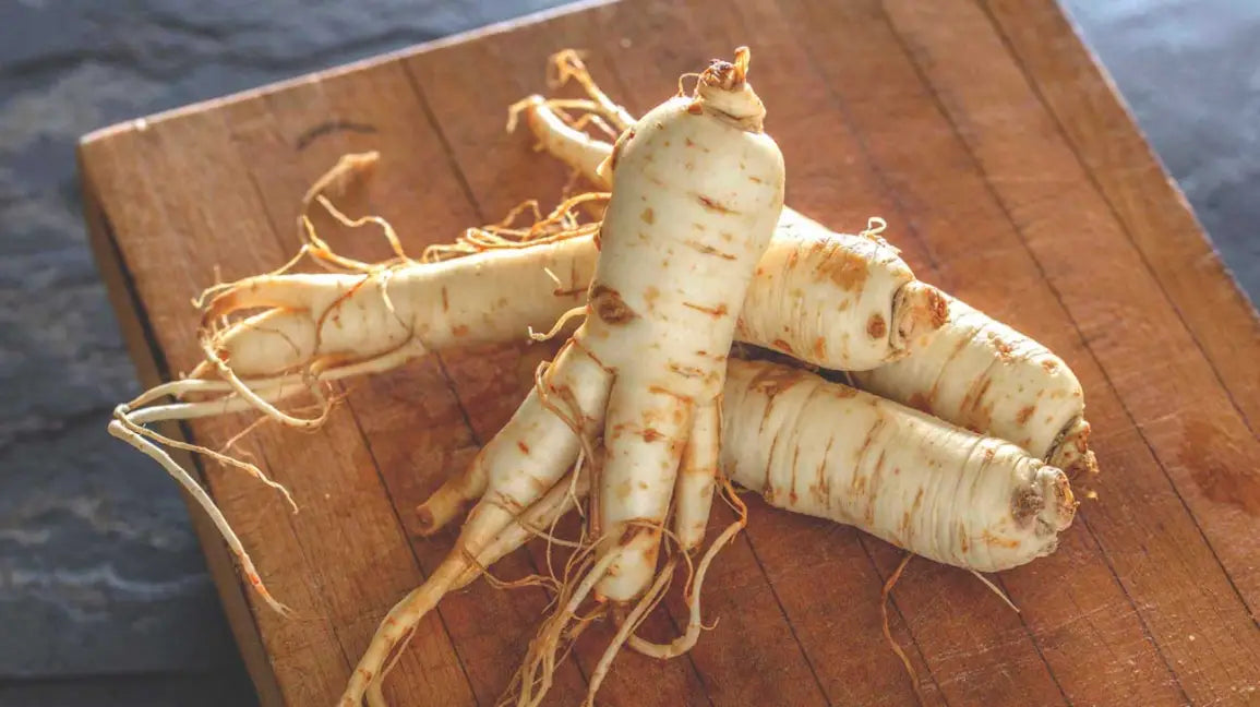 ginseng root on cutting board